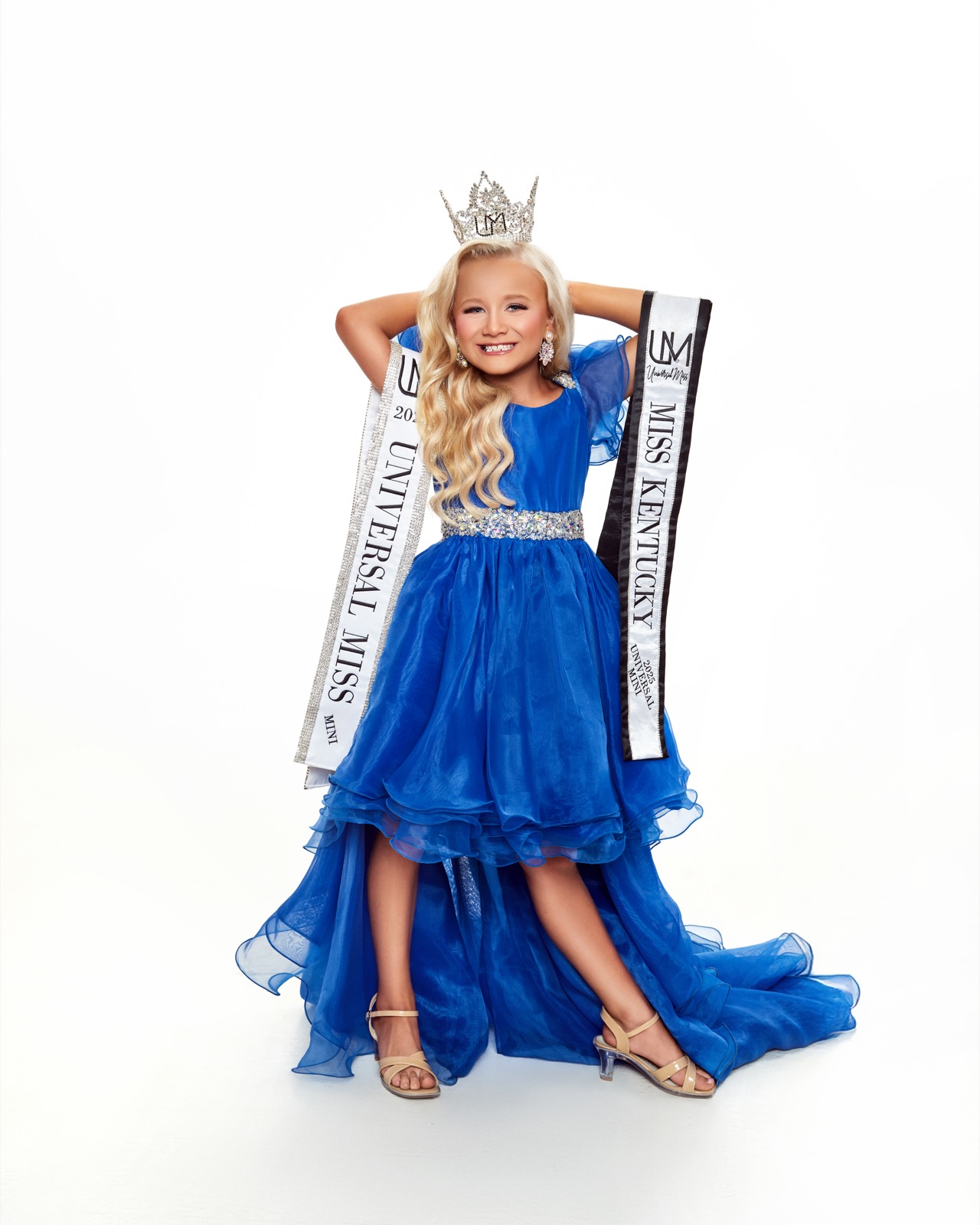 Pageant winner with crown and sash