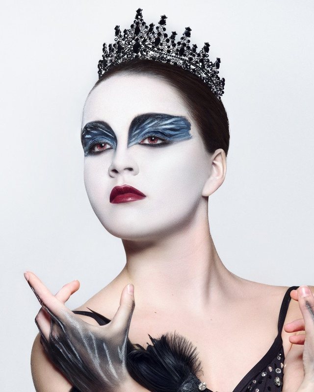 Feathered stage makeup portrait
