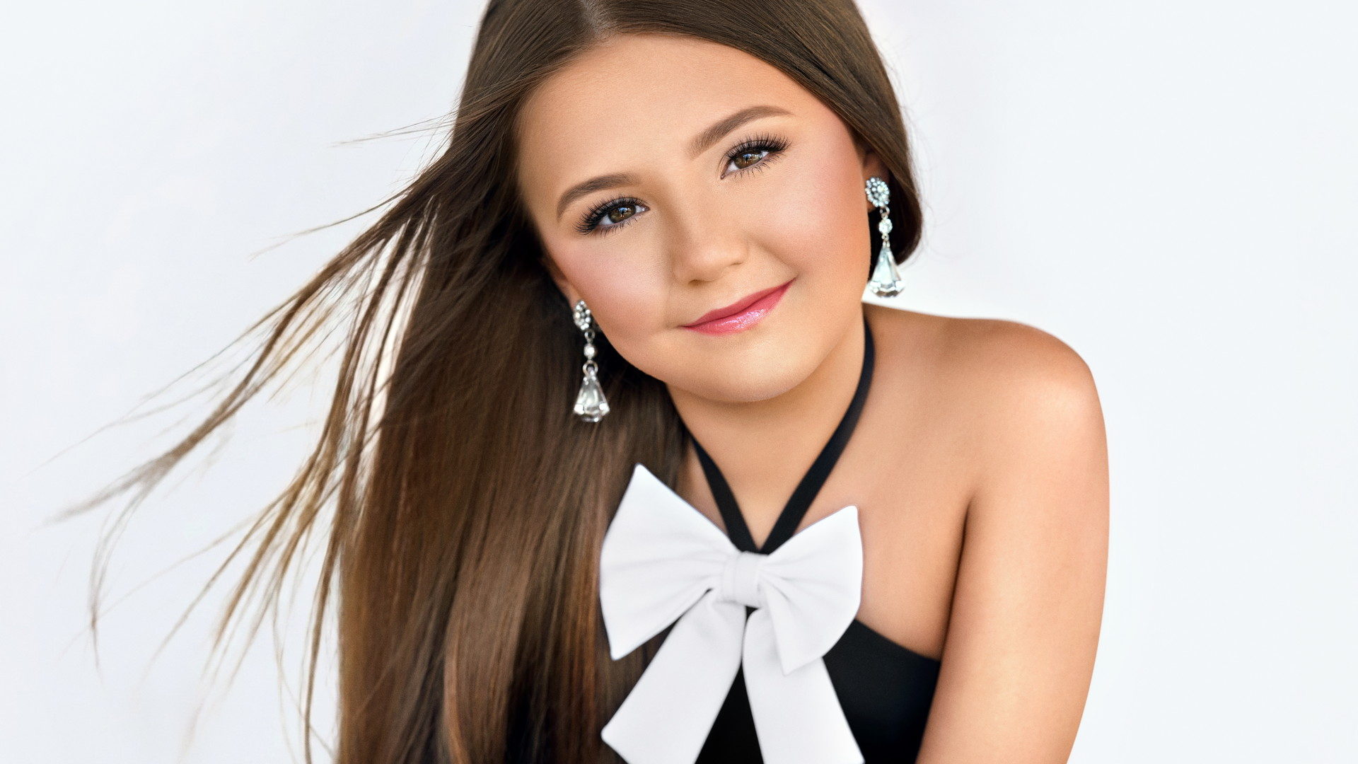 Headshot with a white bow